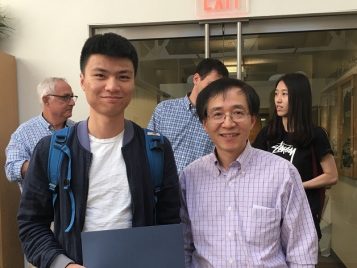 Professor Xuming He awarding Rui Zhang an Outstanding first year Master's student award for the 2015-2016 academic year 